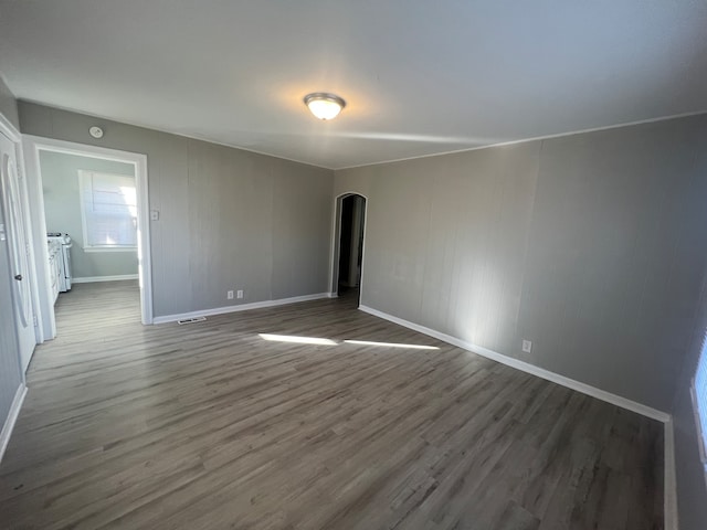 spare room with wood-type flooring