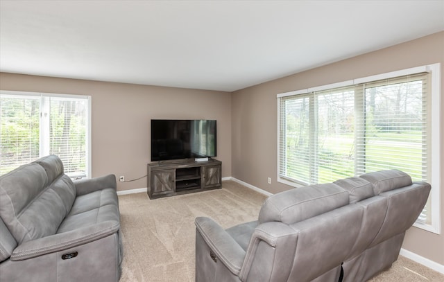 living room featuring a healthy amount of sunlight and carpet floors