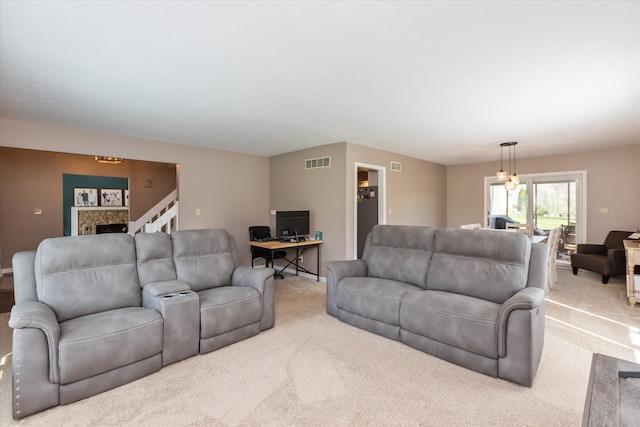 living room with carpet flooring and a fireplace