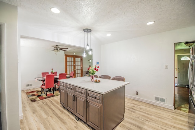 2925 Highwoods Dr, Indianapolis, IN 46222 - kitchen with visible vents, french doors, and light wood-style floors
