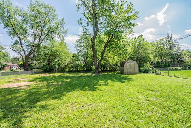 2925 Highwoods Dr, Indianapolis, IN 46222 - view of yard with a fenced backyard, a storage unit, and an outdoor structure