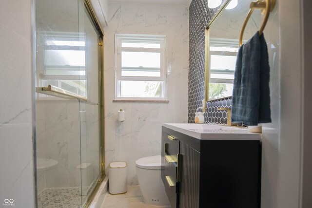2925 Highwoods Dr, Indianapolis, IN 46222 - bathroom featuring a marble finish shower, vanity, and toilet