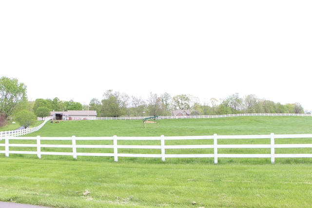 view of yard with a rural view