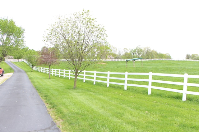 view of yard with a rural view