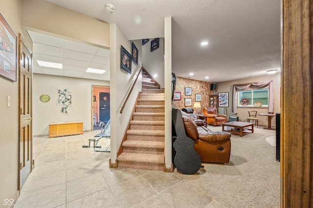 staircase with light tile floors