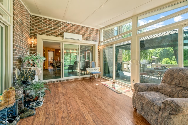 sunroom featuring a wall mounted AC