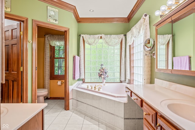 bathroom with a healthy amount of sunlight, a relaxing tiled bath, toilet, and vanity