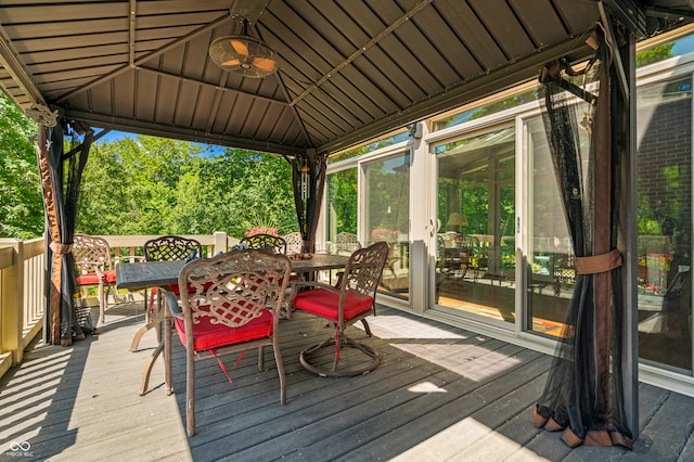 wooden terrace featuring a gazebo