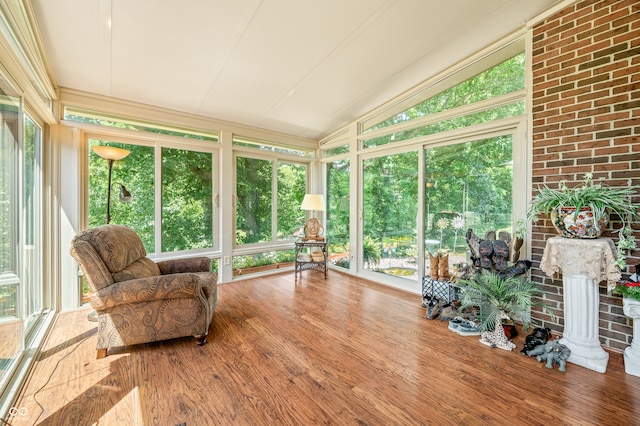 sunroom with lofted ceiling and a wealth of natural light