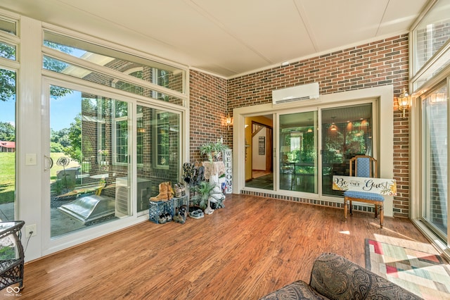 sunroom / solarium featuring an AC wall unit