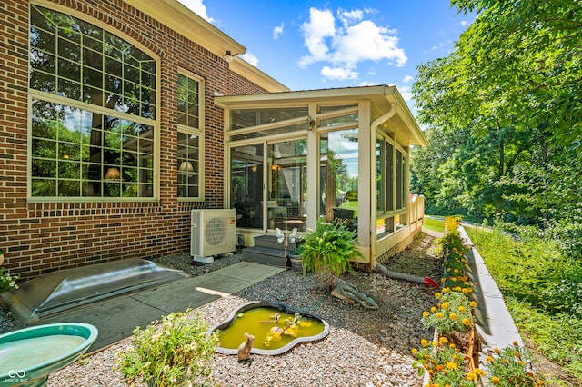 view of terrace featuring a sunroom