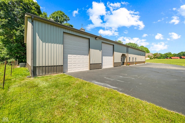 garage with a yard