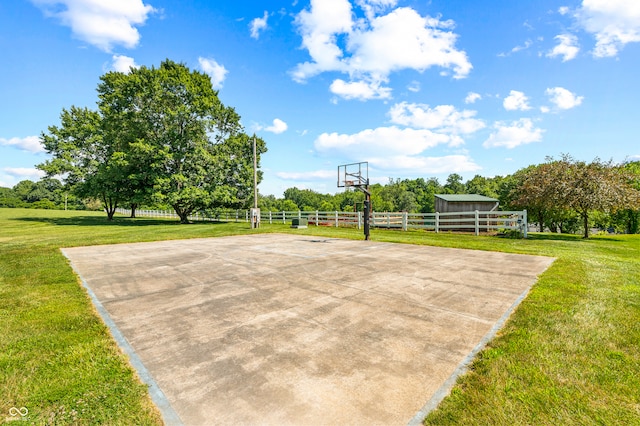 view of basketball court featuring a yard