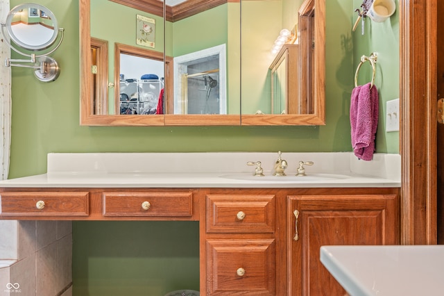 bathroom with ornamental molding and vanity