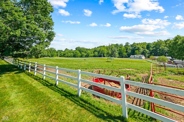 view of yard with a rural view