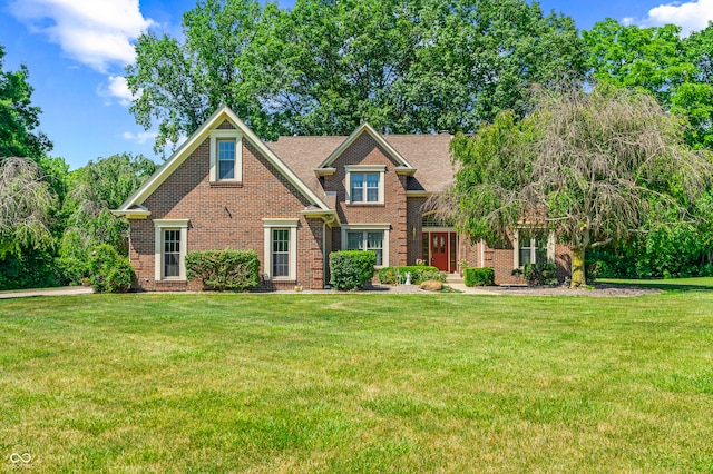 craftsman-style home with a front lawn