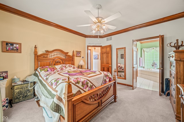 carpeted bedroom with ornamental molding, ceiling fan, and ensuite bath