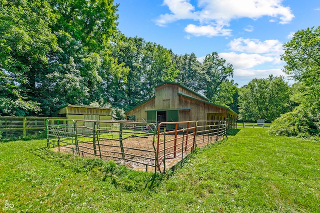 view of yard with a rural view and an outdoor structure