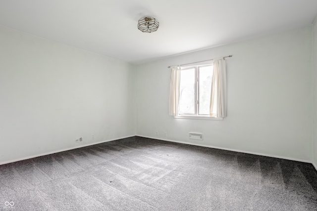 spare room featuring carpet