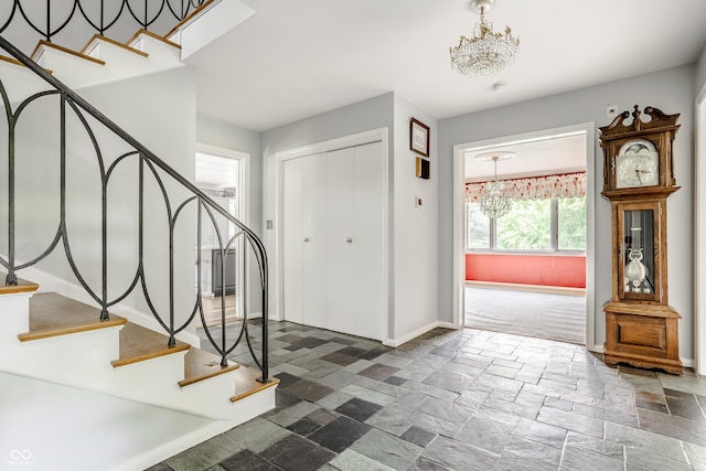 foyer entrance featuring a chandelier