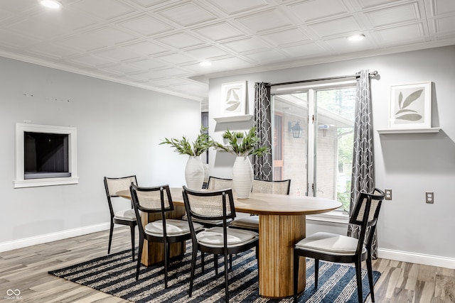 dining space with hardwood / wood-style floors