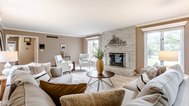 living room with a fireplace, light carpet, and crown molding