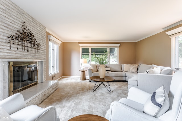 carpeted living room with a fireplace and ornamental molding