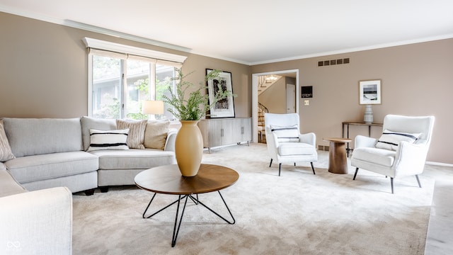 carpeted living room featuring ornamental molding