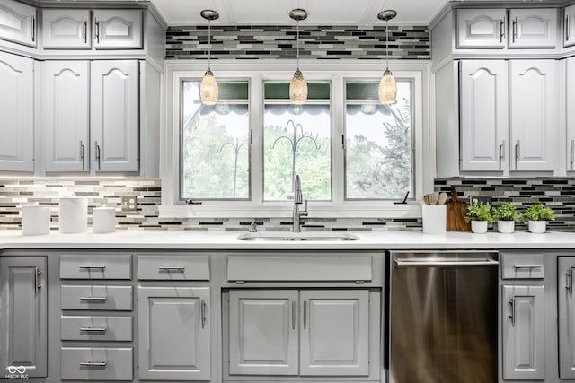 bar featuring gray cabinetry, dishwasher, hanging light fixtures, and sink