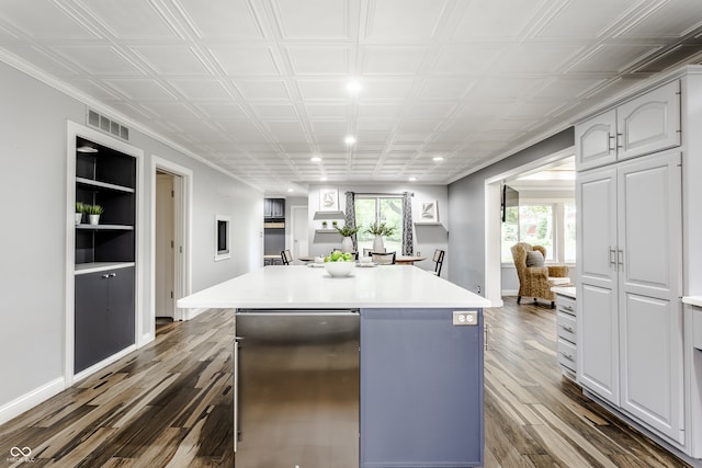 kitchen featuring refrigerator, dark hardwood / wood-style floors, and a kitchen island