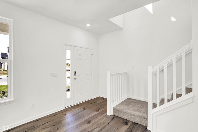 foyer with dark hardwood / wood-style flooring