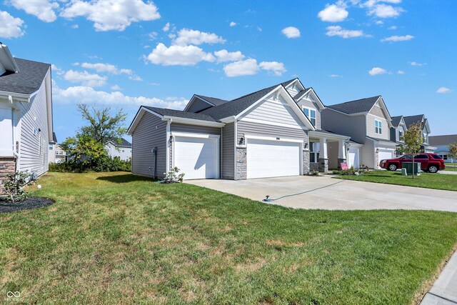 view of front of home featuring a garage and a front lawn