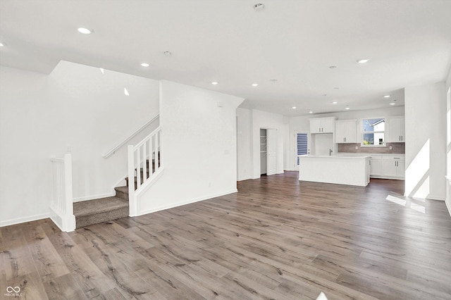 unfurnished living room featuring light wood-type flooring