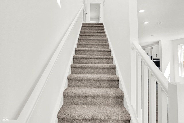 staircase with carpet flooring