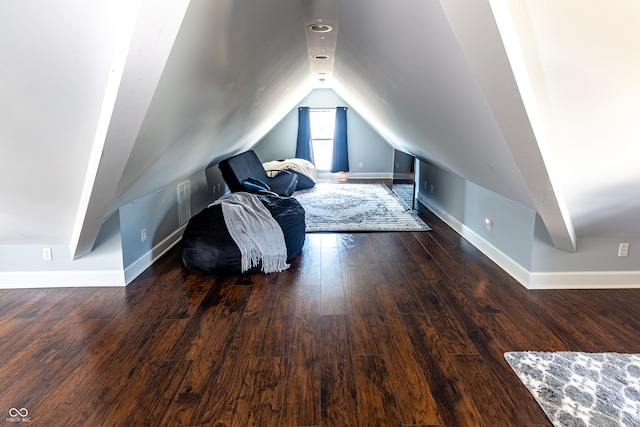 additional living space with lofted ceiling and hardwood / wood-style floors