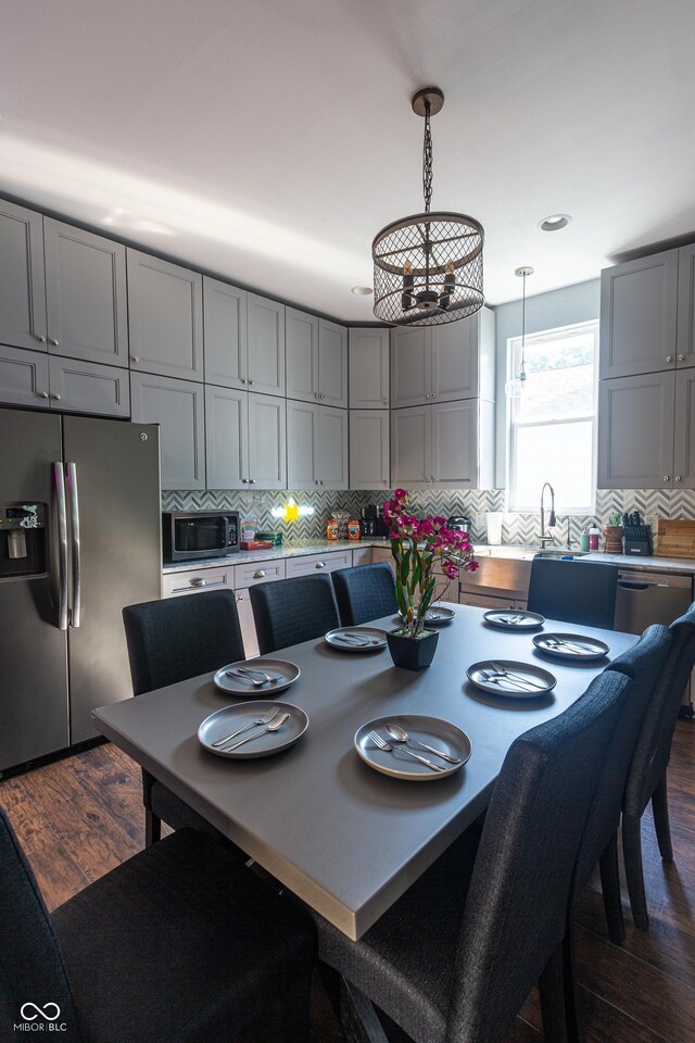 dining room with dark hardwood / wood-style flooring