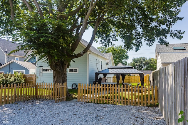 view of side of home featuring a gazebo