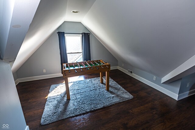 interior space featuring hardwood / wood-style flooring and lofted ceiling