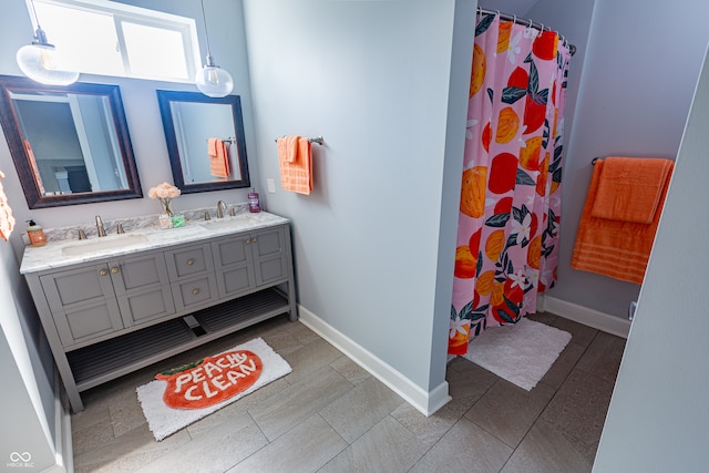 bathroom featuring tile patterned flooring, vanity, and a shower with curtain