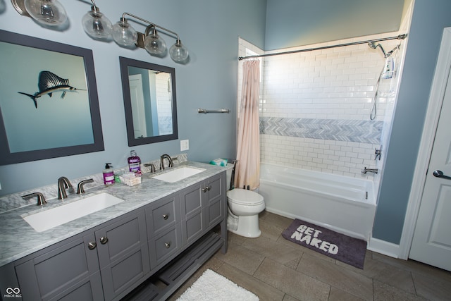 full bathroom featuring toilet, vanity, shower / tub combo, and tile patterned floors