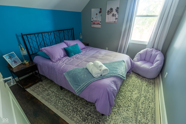 bedroom featuring lofted ceiling