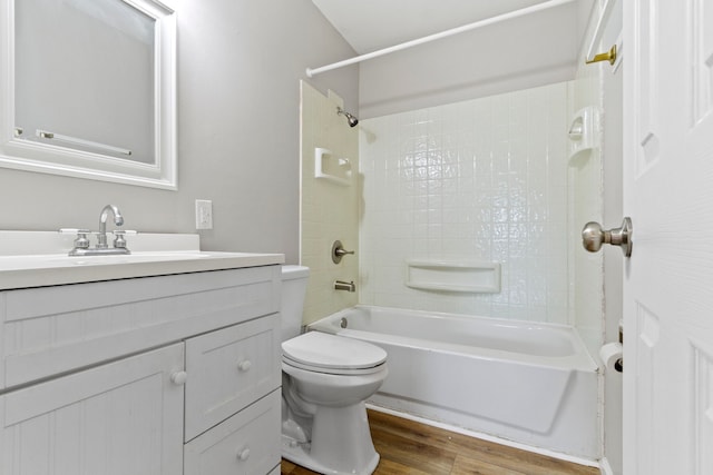 full bathroom featuring wood-type flooring, vanity, toilet, and tiled shower / bath