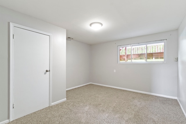 empty room featuring light colored carpet