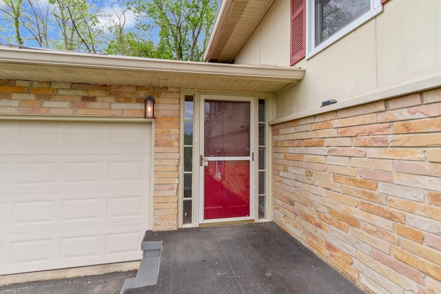 entrance to property featuring a garage