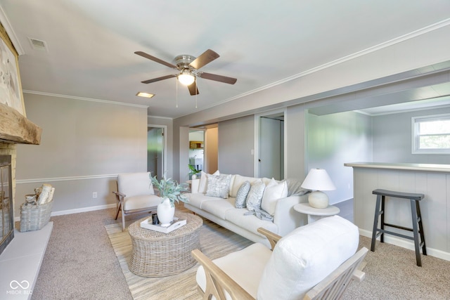 carpeted living room with ornamental molding and ceiling fan