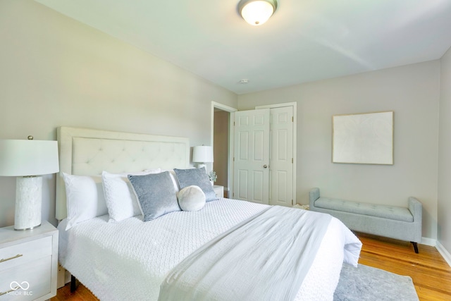 bedroom featuring light hardwood / wood-style flooring and a closet