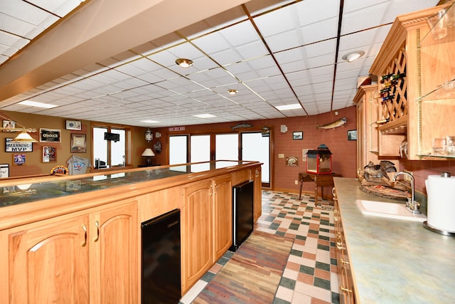 kitchen with sink and beverage cooler