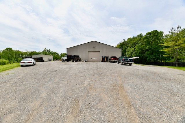 exterior space featuring an outdoor structure and a garage