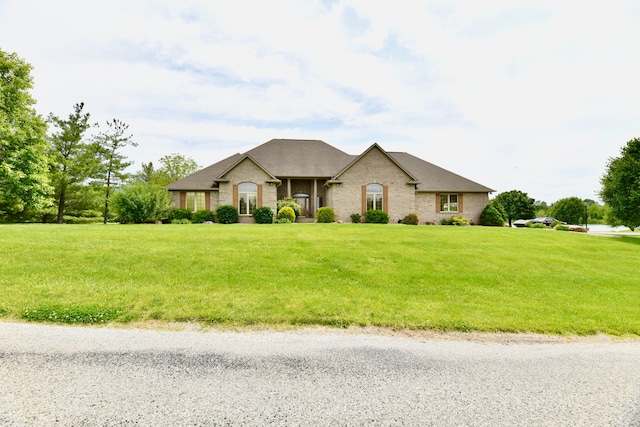 french country style house with a front yard