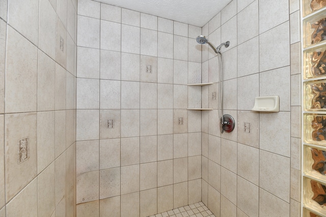 bathroom with tiled shower